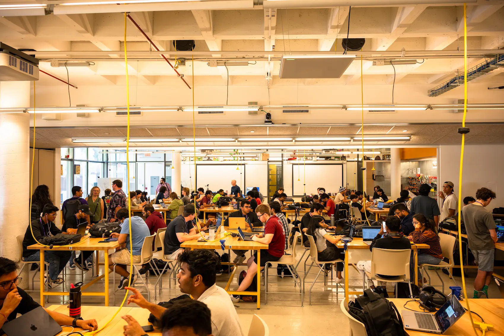 Developers, designers, and nonprofit partners collaborating at an Opportunity Hack event